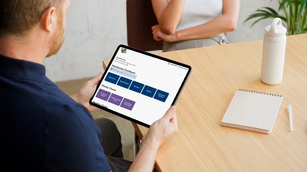 Maintenance Log dashboard displayed on a tablet.